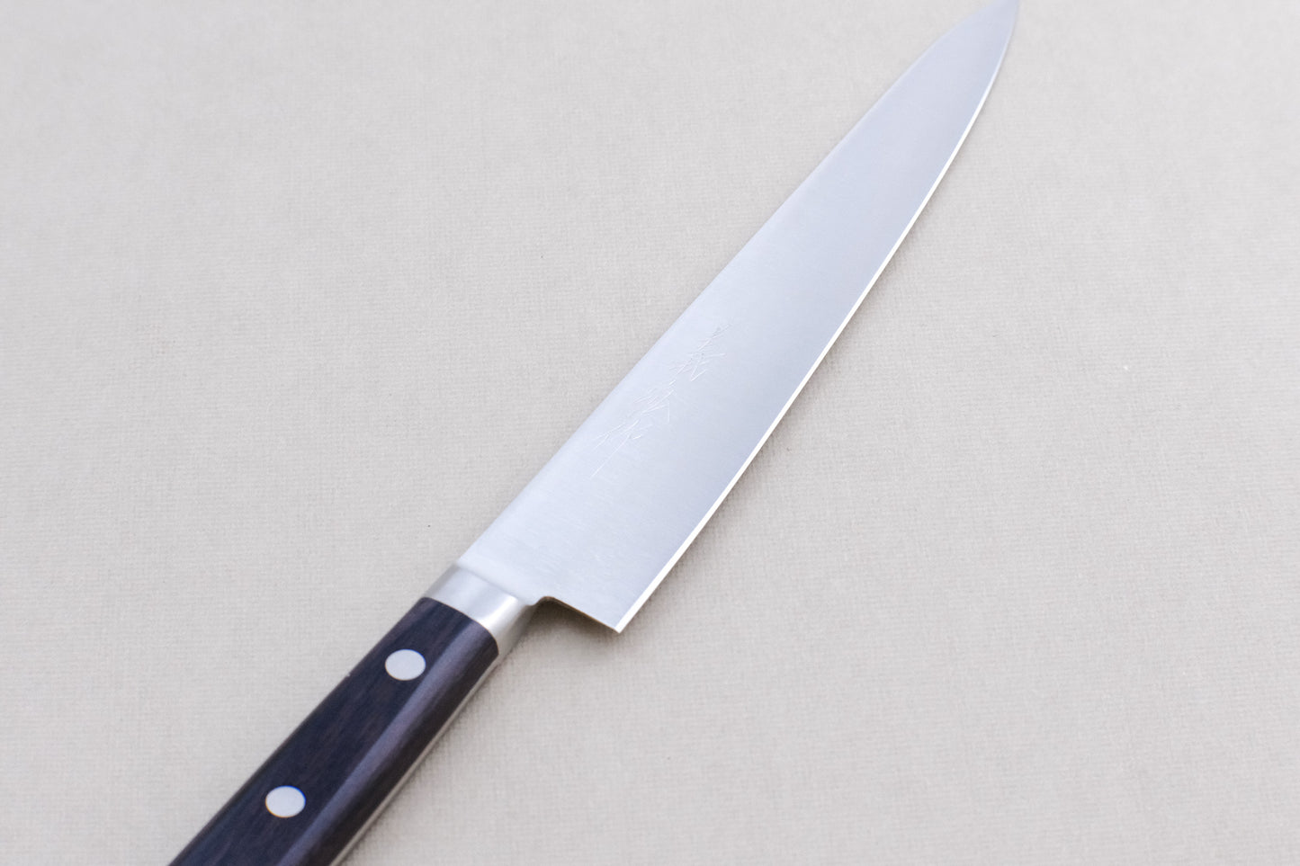 Yoshihiro 1141 8A stainless steel petty 180 with a pakka handle