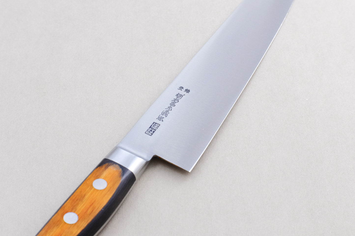 Yoshihiro HGB SK4 gyuto 240 with a pakka handle