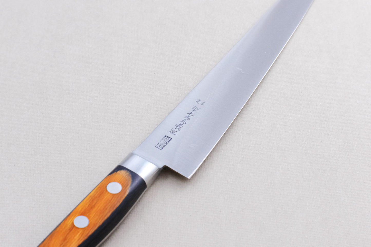 Yoshihiro HGB SK4 sujihiki 240 with a pakka handle