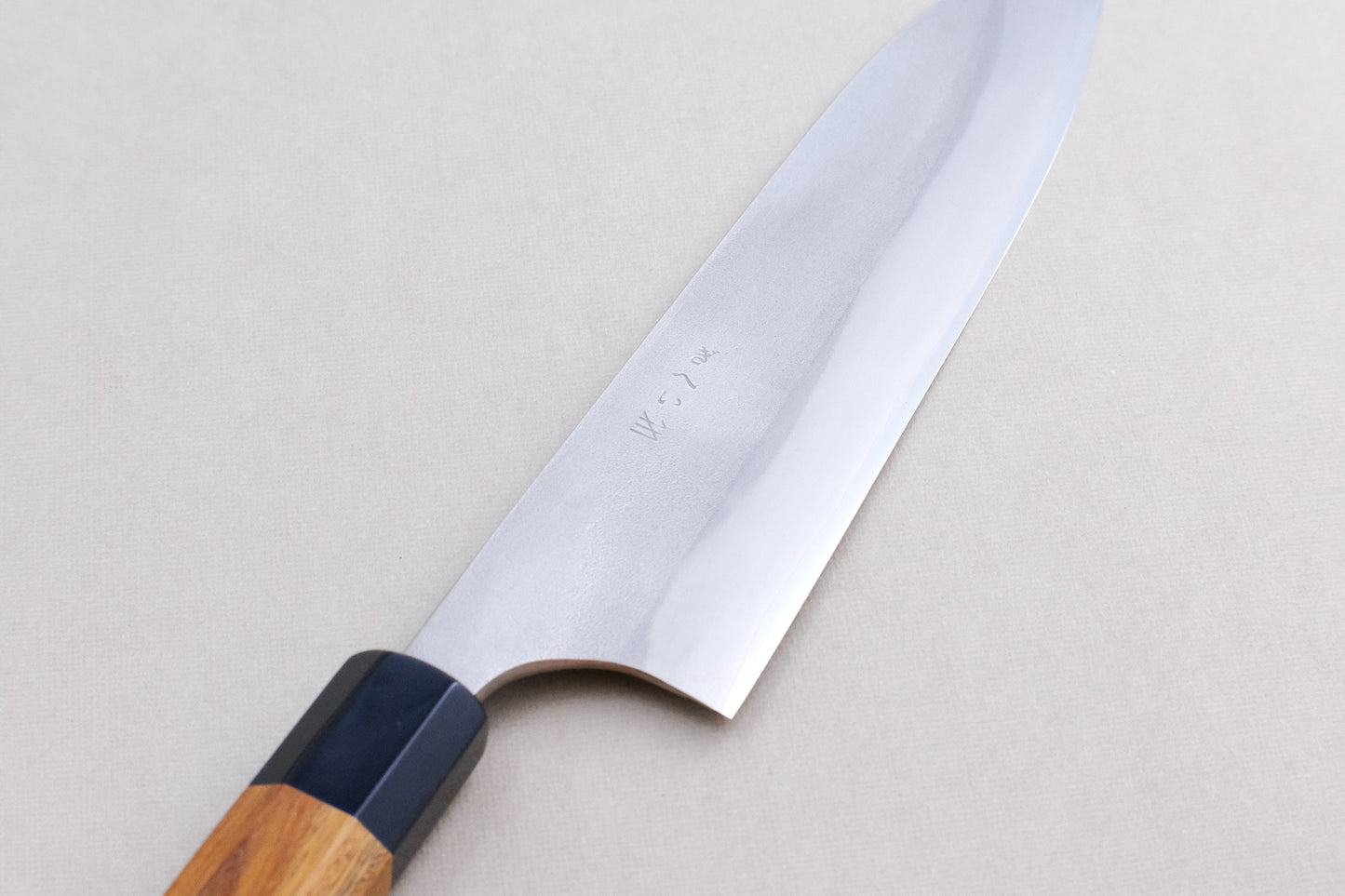 Gihei stainless clad aogami 2 nashiji gyuto with a palo santo handle and buffalo horn collar 210 mm