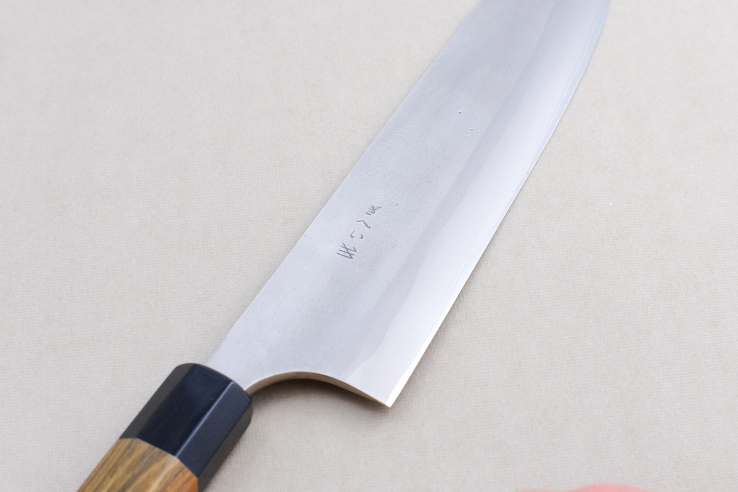 Gihei stainless clad aogami 2 nashiji gyuto with a palo santo handle and buffalo horn collar 240 mm