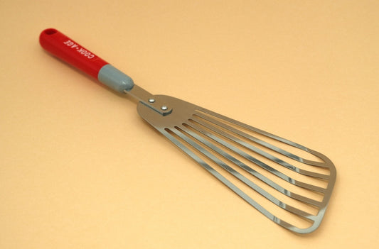 Slotted flexible spatula with a plastic handle