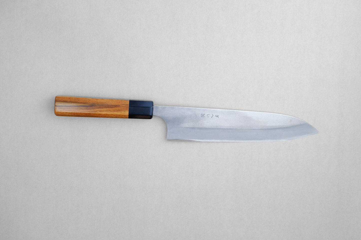 Gihei stainless clad aogami 2 nashiji gyuto with a palo santo handle and buffalo horn collar 210 mm