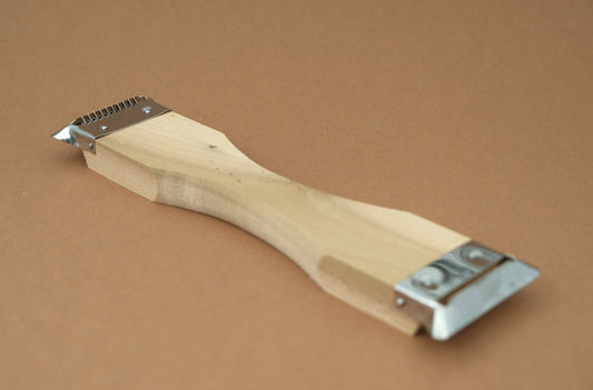 Double sided peeler with a magnolia wooden handle