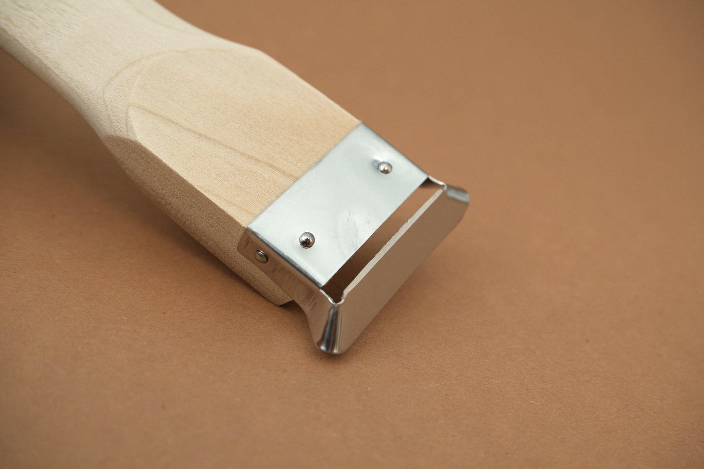 Stainless steel peeler with magnolia wooden handle