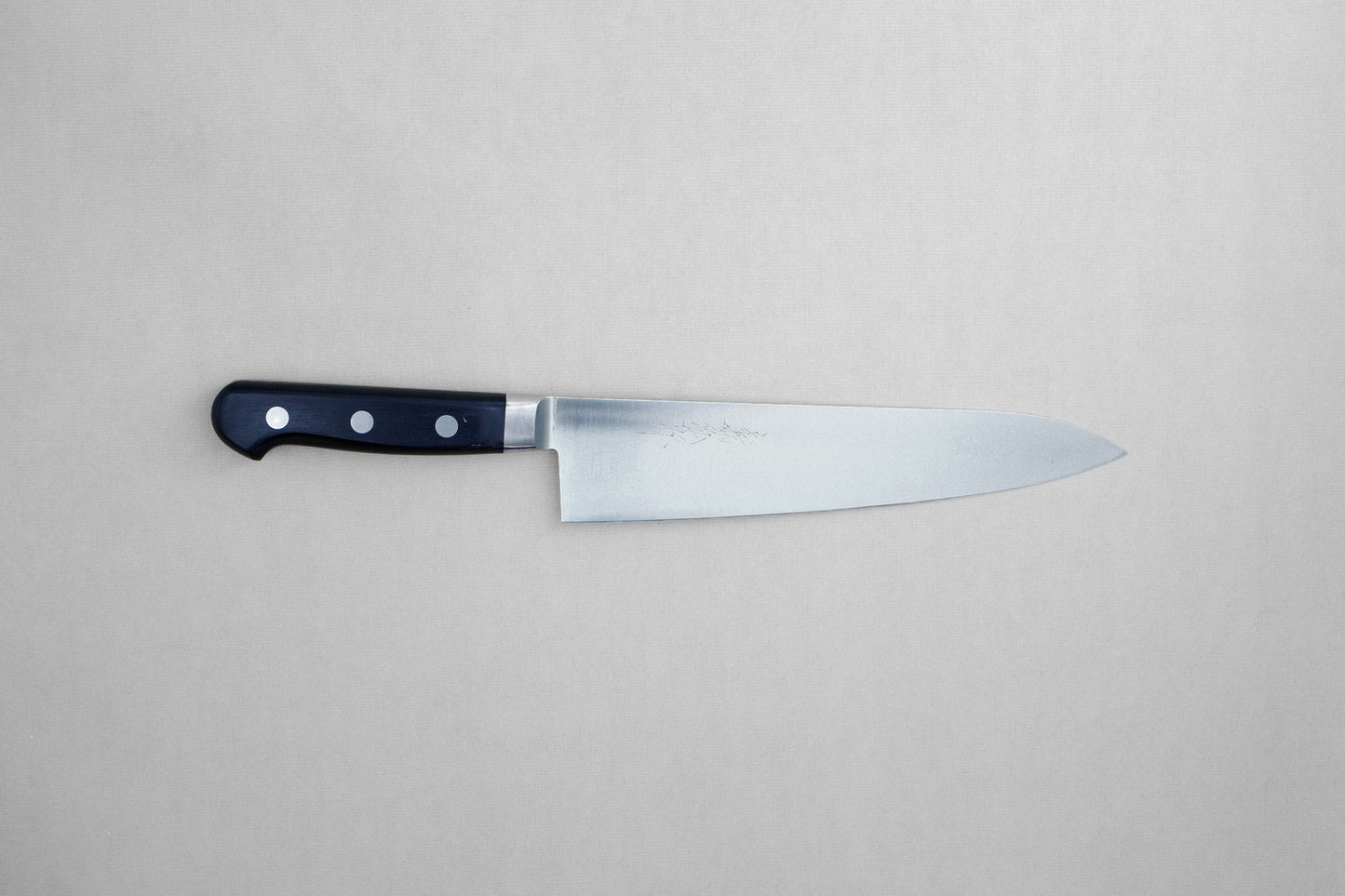 Yoshihiro 1141 8A stainless steel gyuto 210 with a pakka handle