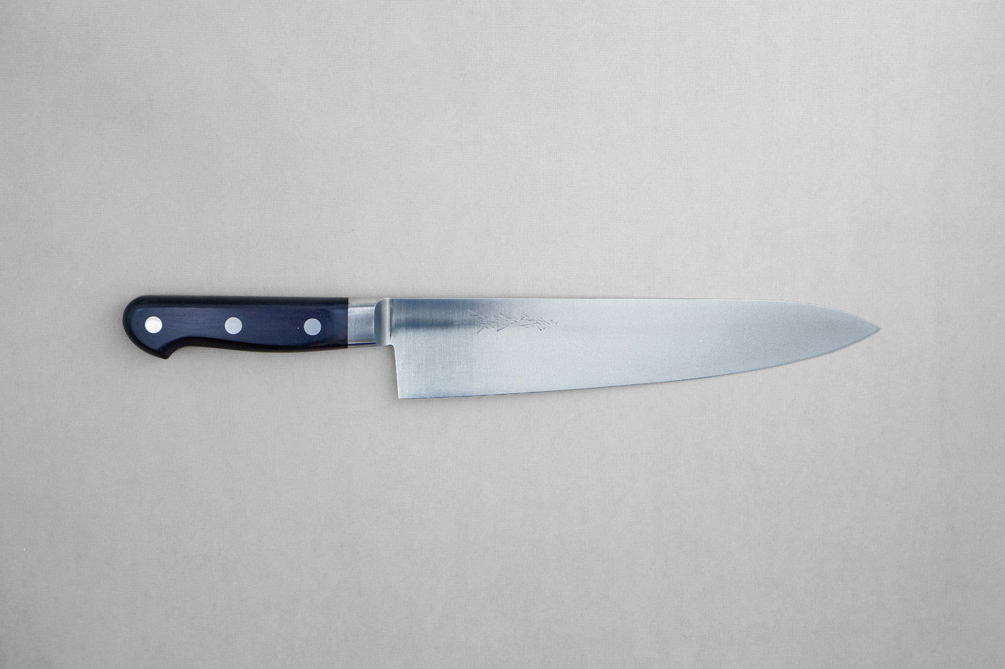 Yoshihiro 1141 8A stainless steel gyuto 240 with a pakka handle