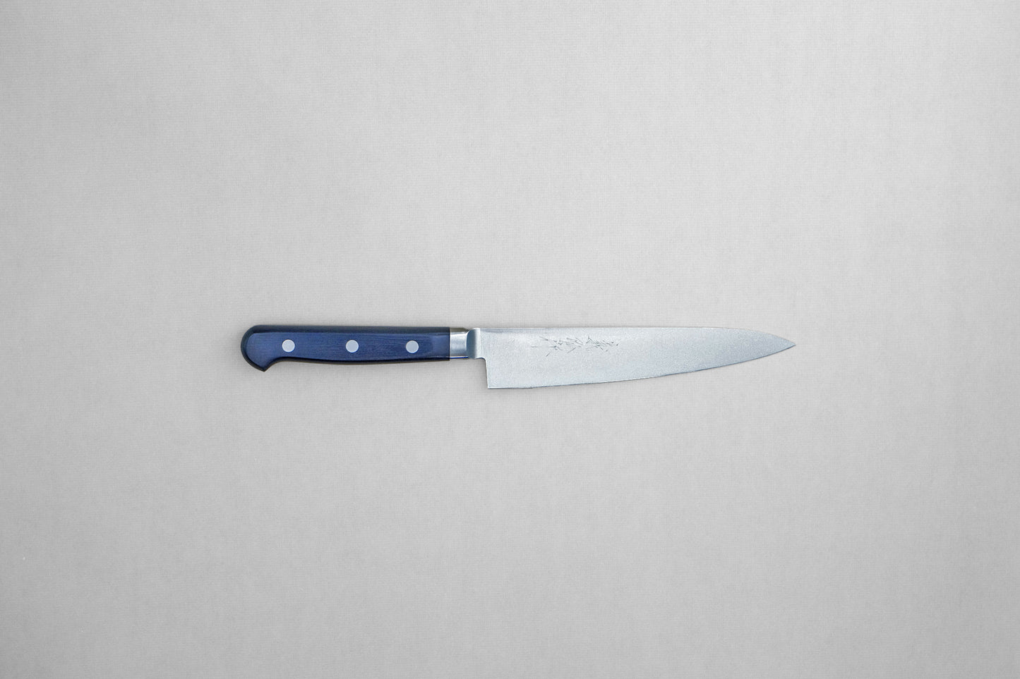 Yoshihiro 1141 8A stainless steel petty 150 with a pakka handle