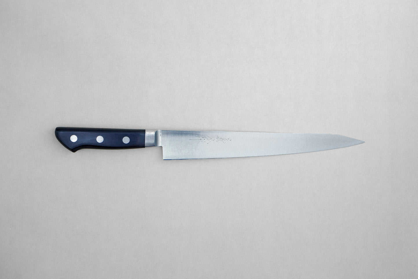 Yoshihiro 1141 8A stainless steel sujihiki 240 with a pakka handle